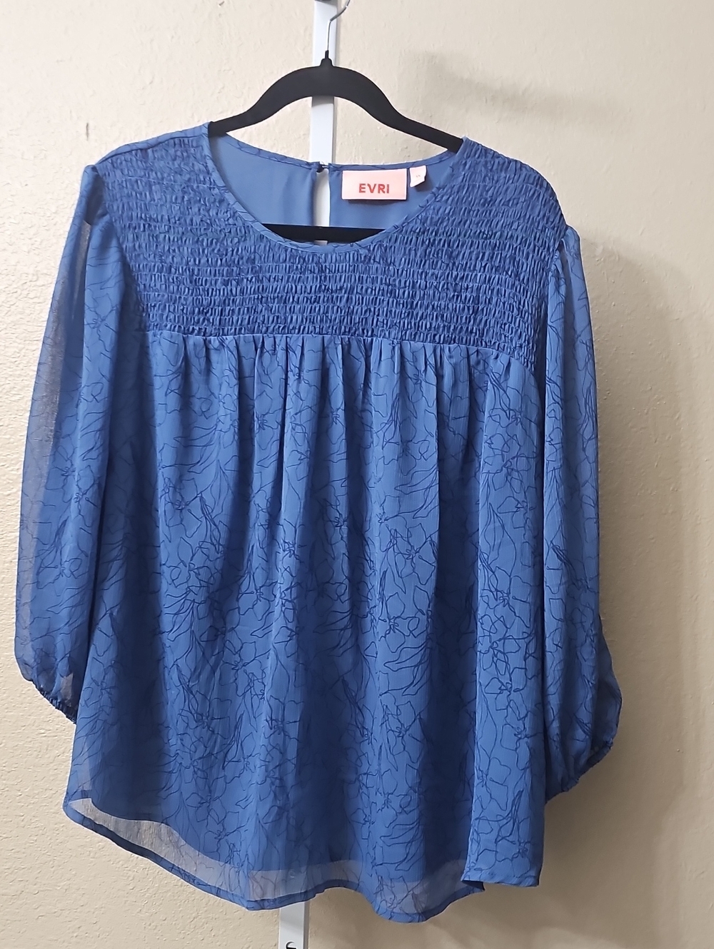 A blue Evri floral patterned blouse